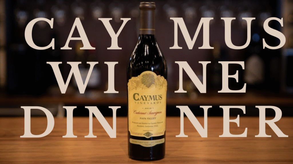 A bottle of Caymus Cabernet Sauvignon in focus with a warmly lit, softly blurred background.