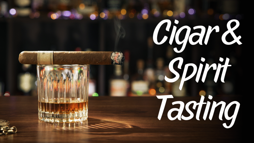 A dark amber spirit in a lowball rocks glass with a cigar resting on the rim against a black background.