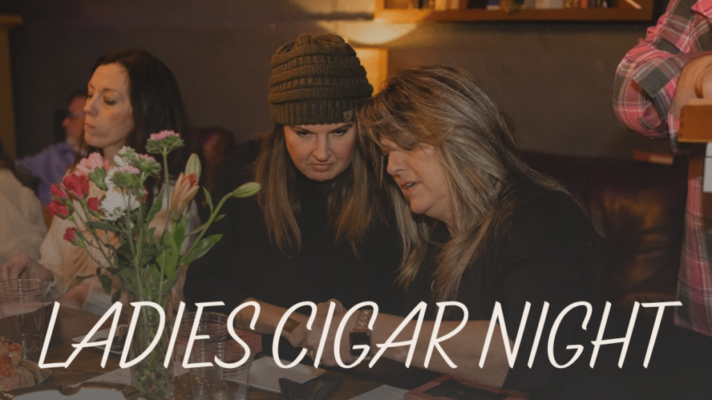 Two women as they light a cigar together, sharing the moment and learning from each other.