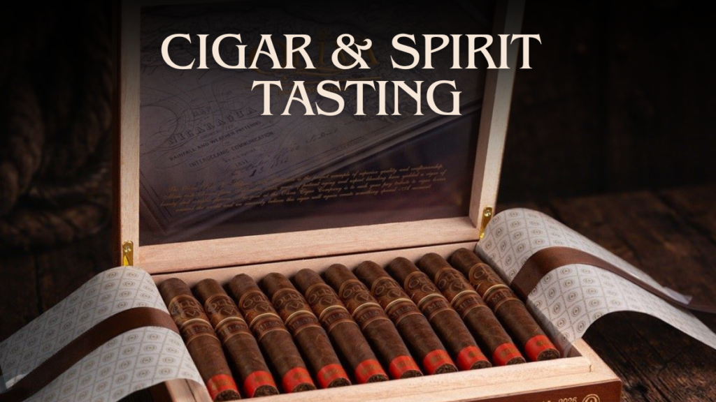 Guests enjoying premium Oliva cigars and whiskey during a summer cigar and spirit tasting in the Mayor's Cigar Lounge at Vineyard Market.